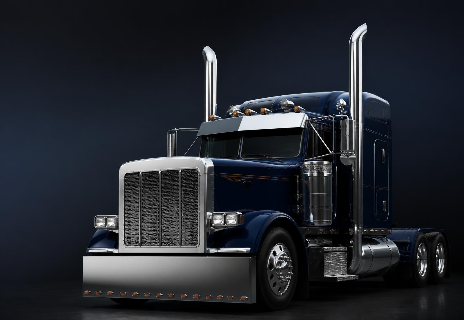 Class A tractor-trailer on an open highway at sunrise